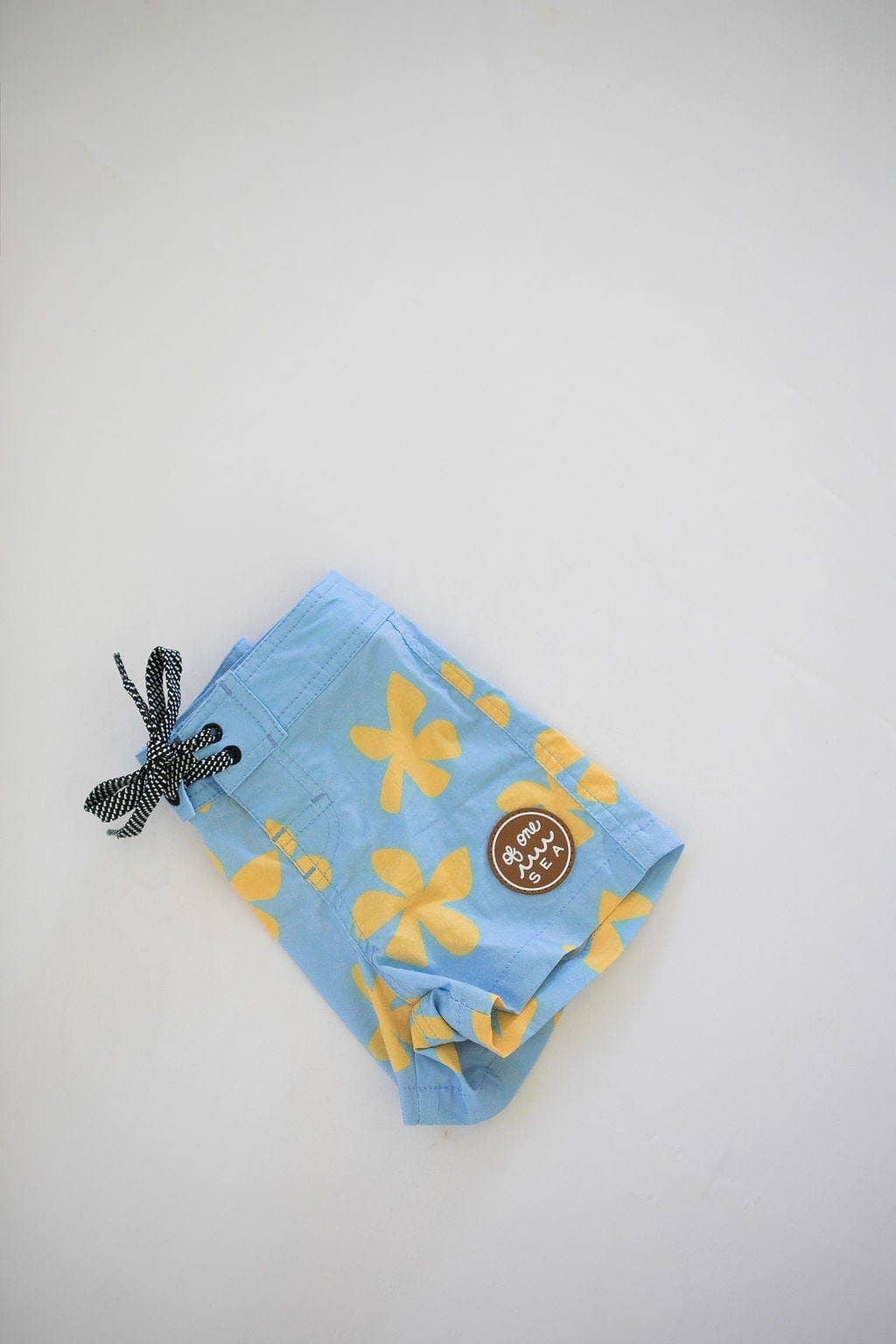 Kid’s Townshort Boardshorts in Light Blue Plumeria for wholesale on Faire8