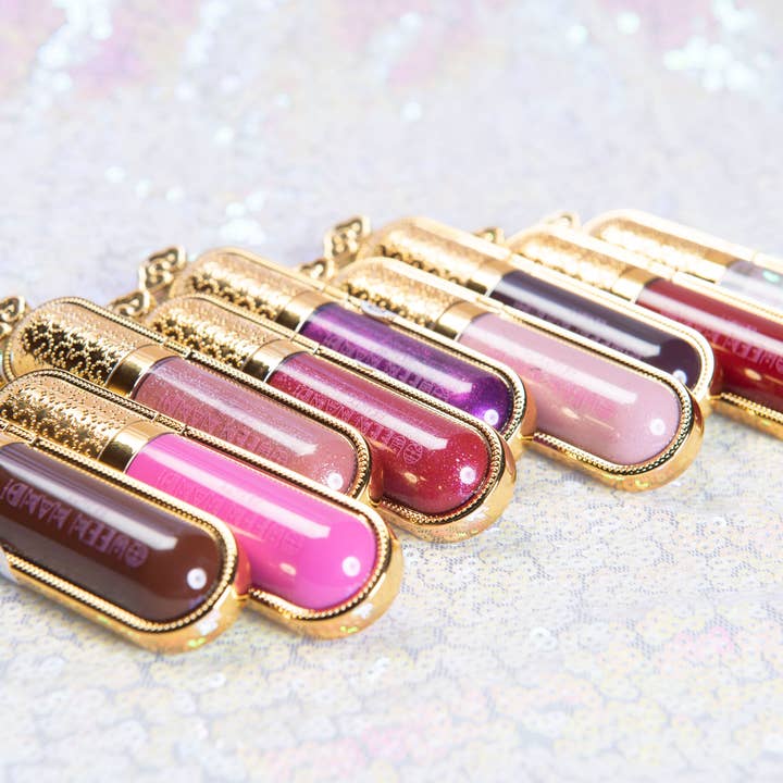 Queen Nandi Beauty – wholesale Läppglans – Queen Lipgloss #035 - skimrande nude med persikoton3