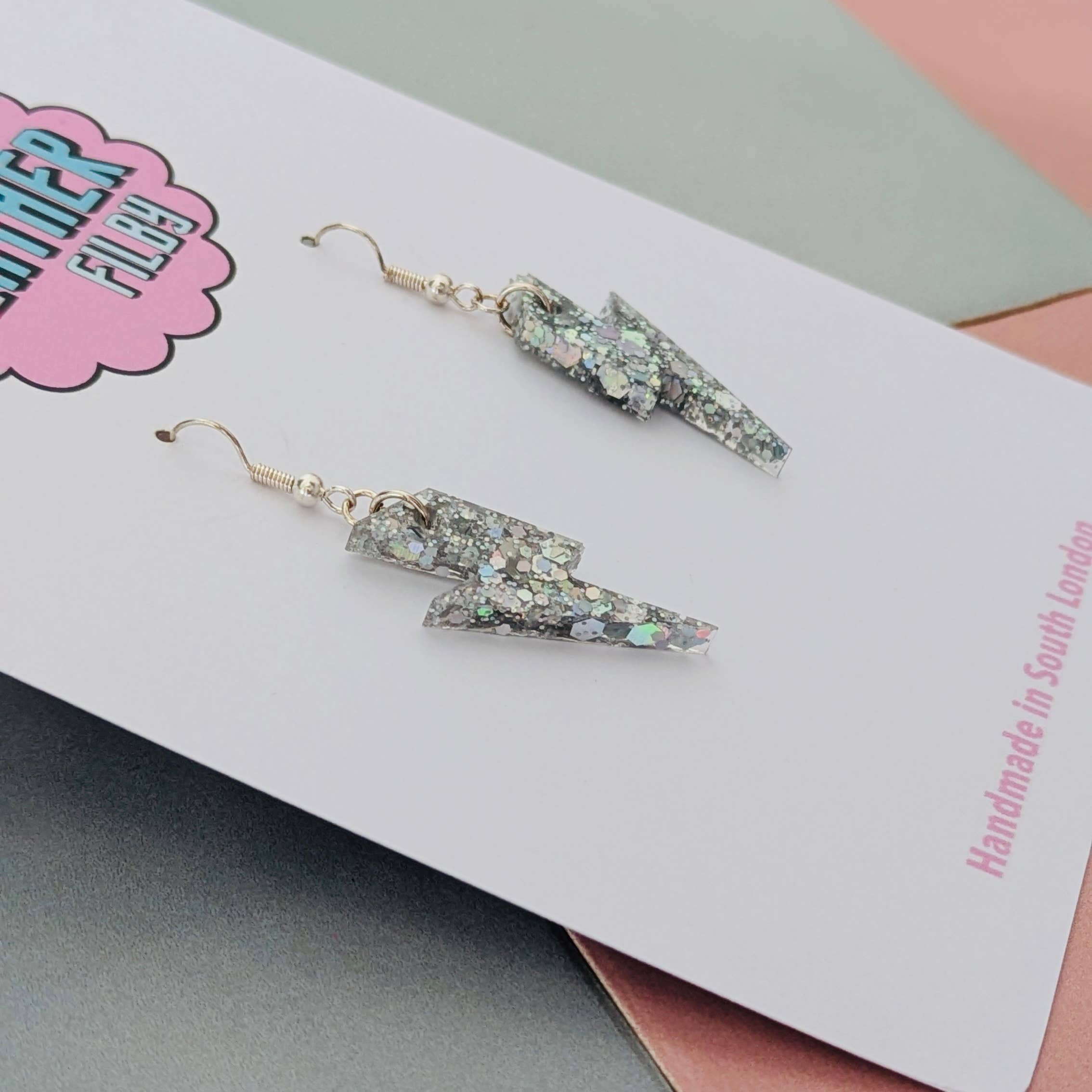 By Heather Filby – wholesale Dangle earrings – Small Silver Glitter Lightning Bolt Earrings1