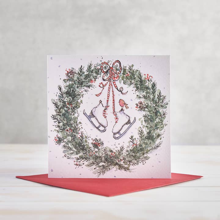 Vintage Ice Skates and Wreath Christmas Greetings Card for wholesale by Helen Wiseman Illustration