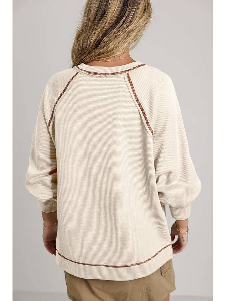 Beige Exposed Seam Textured Knit V Neck Pullover Top for wholesale on Faire
