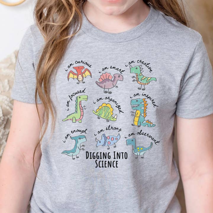 Maglietta Scienza dei Dinosauri STEM per Giovani - T-shirt Scavando nella Scienza per la vendita all'ingrosso da parte di IstiloPrints