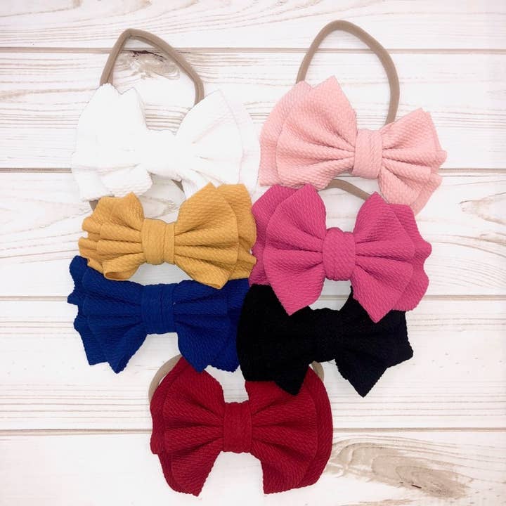 Elastische hoofdband met strik voor wholesale door Melina & Me