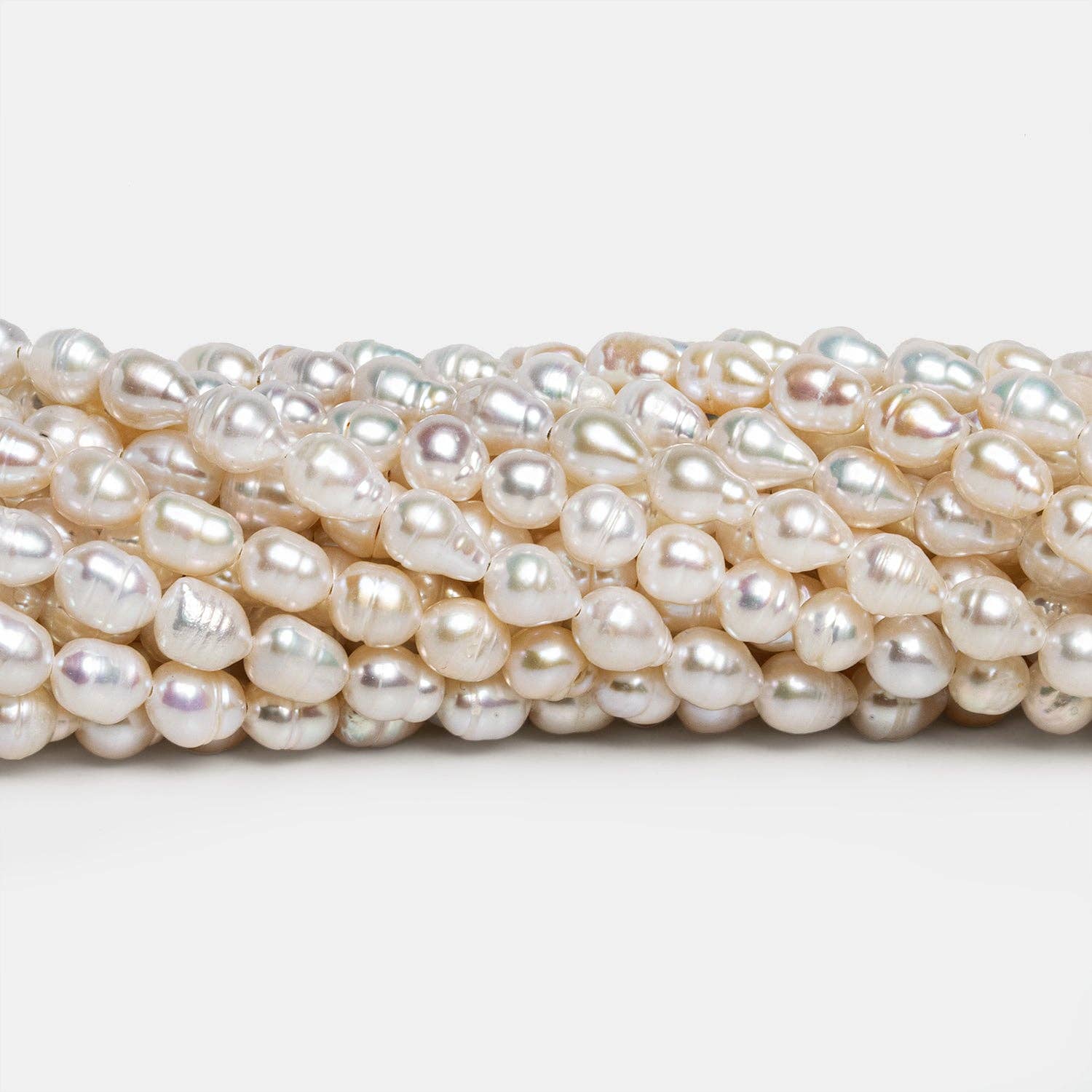 The Bead Traders - Wholesale Beads - 7x5mm Cream Petite Baroque Pearls 15 inch 53 beads0