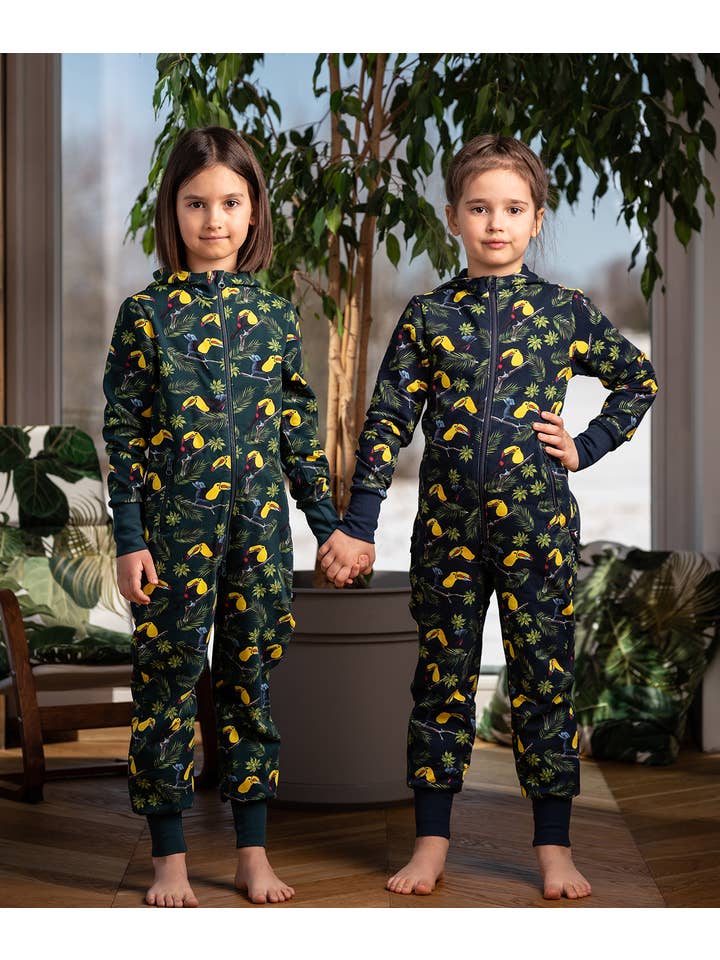 Warm jumpsuit with zipper rear, toucan print, blue for wholesale on Faire2