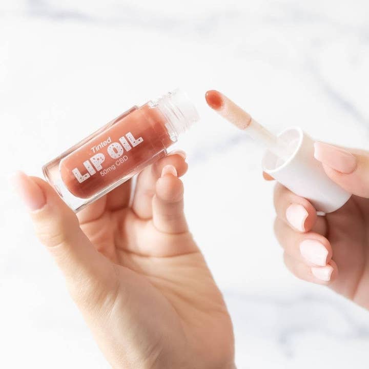 Hydrating Lip Oil with CBD, Vitamin E - Tinted Mocha for wholesale by Twine