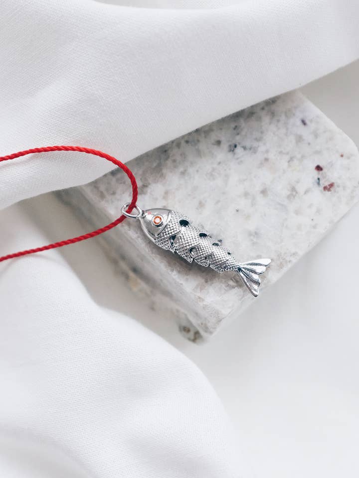 Red String Silver Fish Necklace for wholesale by Lyon and Feather