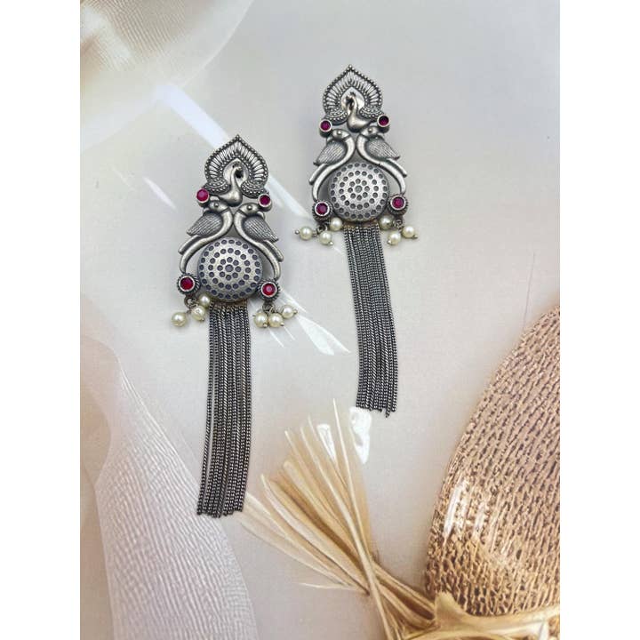 Antique Oxidised German Silver Peacock Tassel Earrings for wholesale by Vastrabhushan
