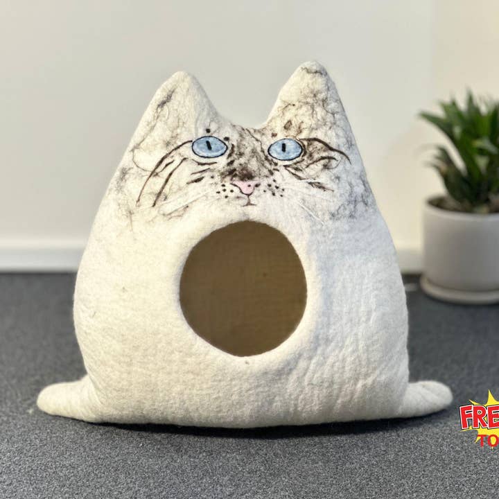Handmade Wool Cat Cave – Blue-Eyed Kitty Face Pet Bed for wholesale by Woollyfelt