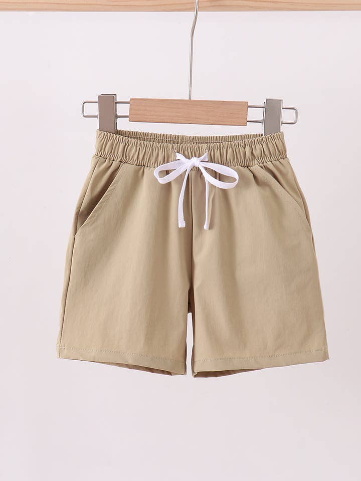 Pantaloncini performanti color cachi con tasche per la vendita all'ingrosso da parte di Aspen Rain Boutique