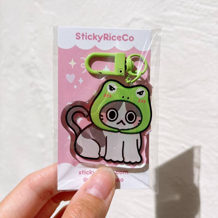 StickyRiceCo - Wholesale Keychain - Women's - Angry Frog Hat Cat Meme Glitter Keychain