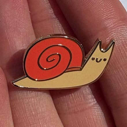 Cute Gold Enamel Snail Pin for wholesale by Aviate Press