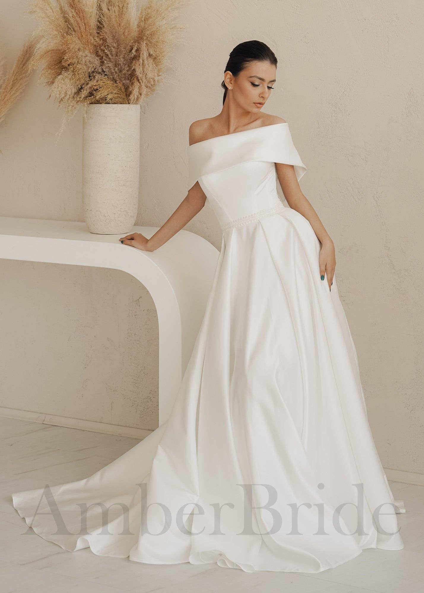 Amber Commerce Group, MB - Wholesale Gown - Women's - STOCK SELL-OUT: Simple A-Line Satin Wedding Dress with Off Shoulder Design and Corset4