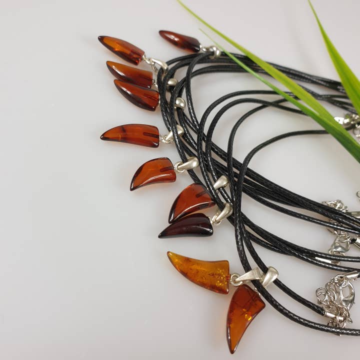 amber fang tooth tusk pendant gemstone small for wholesale by AmberLithuania