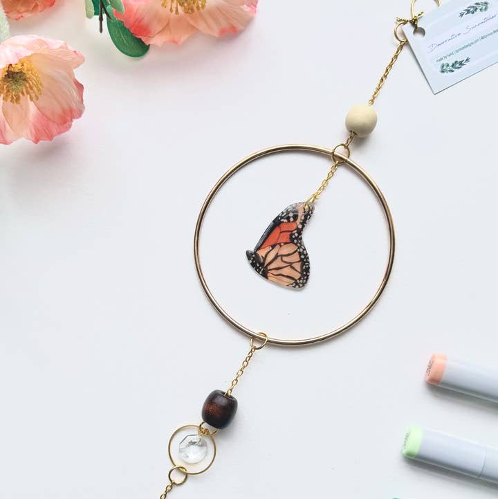 Handmade + Hand-Illustrated Monarch Butterfly Suncatcher with Wood Beads for wholesale by D. Prince Designs