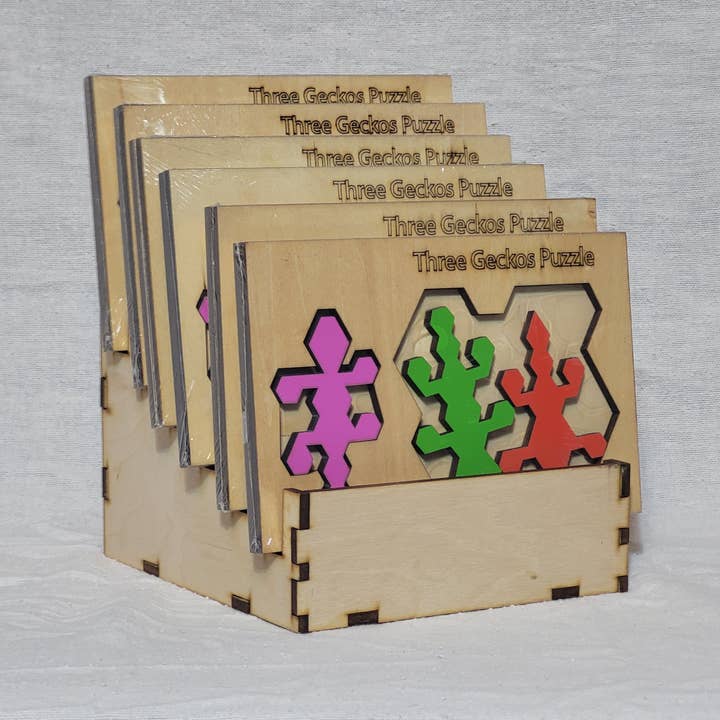 Palmetto Puzzle Works - Venta al por mayor Puzle - Adultos - Puzzles con estante de exhibición recargable de madera