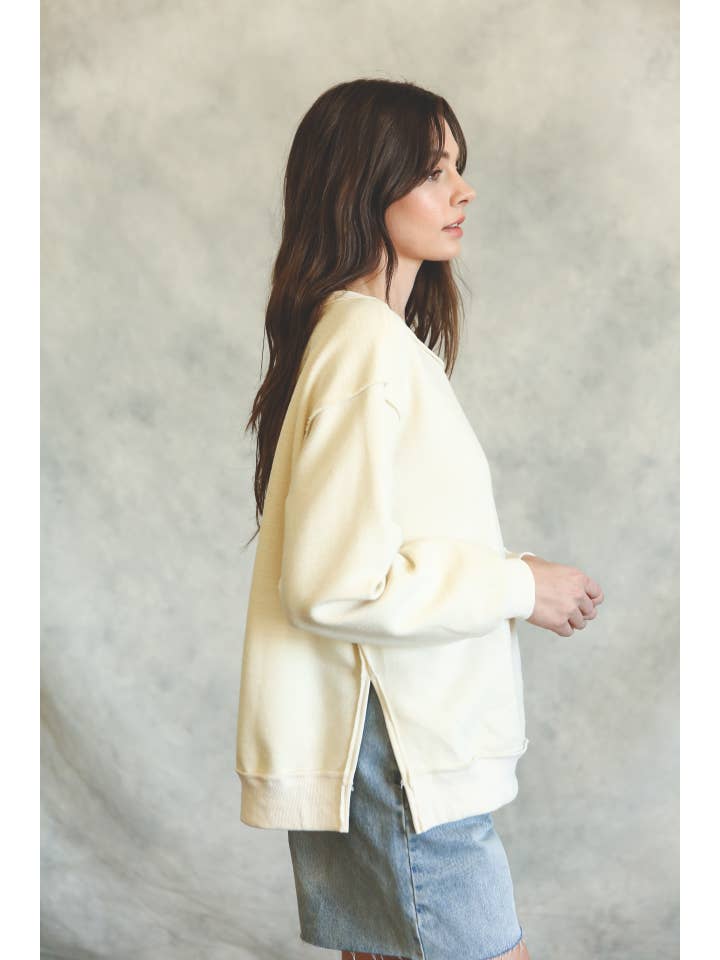 Cream Raw Edge Side Slit Sweatshirt for wholesale on Faire