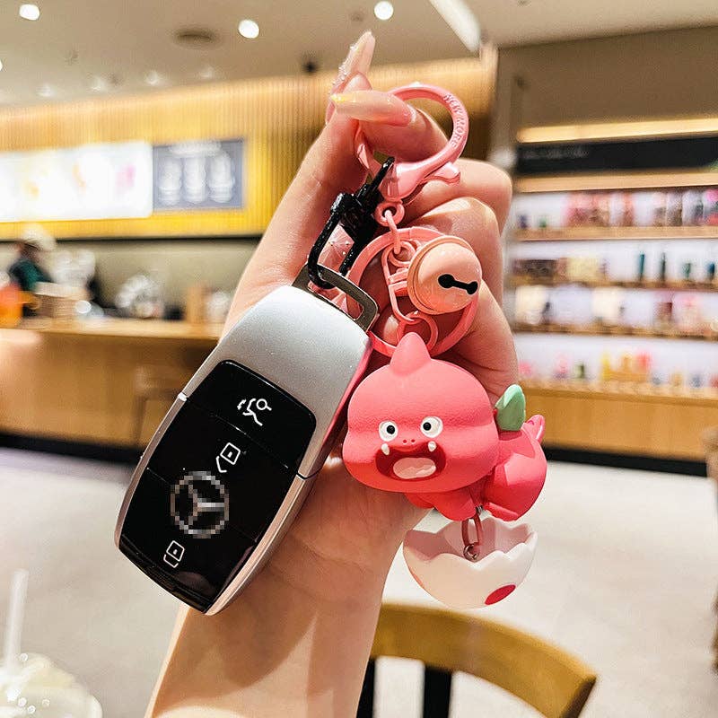 KiddieKickz – wholesale Keychain – Child – Cartoon Dinosaur Holding Egg PVC Soft Keychain5