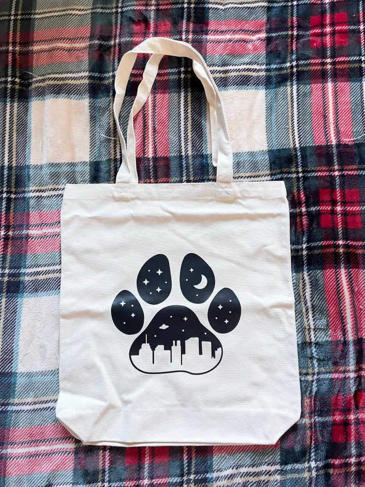 Pawprint with City Skyline Tote Bag, Reusable Shopping Bag for wholesale by Jeanne Mari & Co