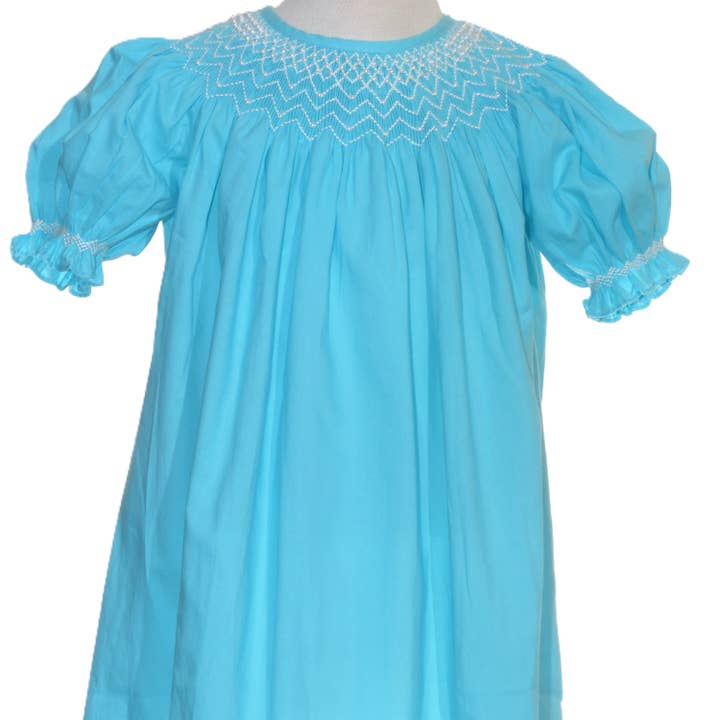 Abito Vescovo a Maniche Corte Blu Geo con Perle Smockate per la vendita all'ingrosso da parte di Hello Bebes!