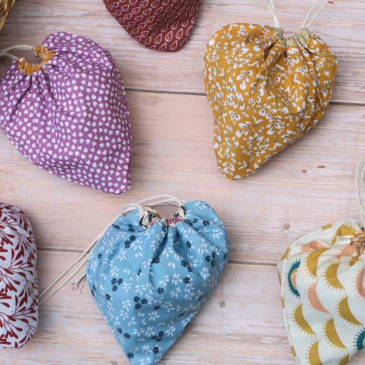 Set of 3 foldable fabric bread bags with decorative patterns for wholesale by Vagabondes