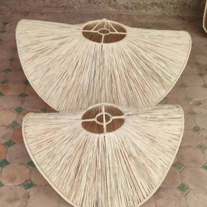 Natural Raffia Pendant Light - Handmade Raffia Lamp and other Purchase Wholesale boho lamp. Free Returns & Net 60 Terms on Faire trending on Faire.