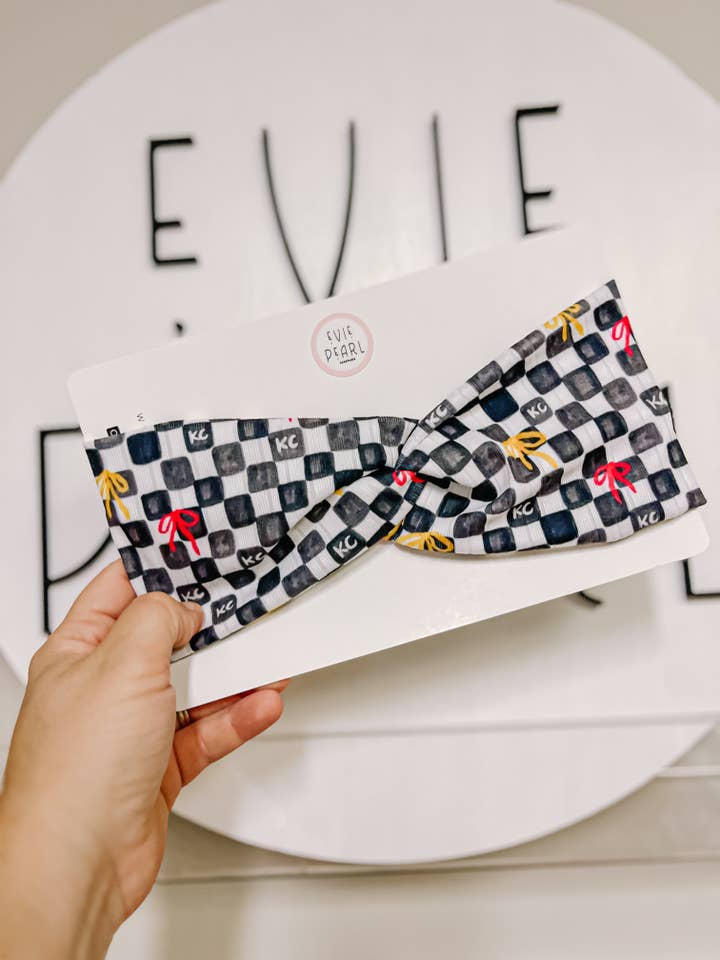 Black KC Bows Checkered Twisted Chiefs Turban for wholesale by Evie Pearl Handmade LLC