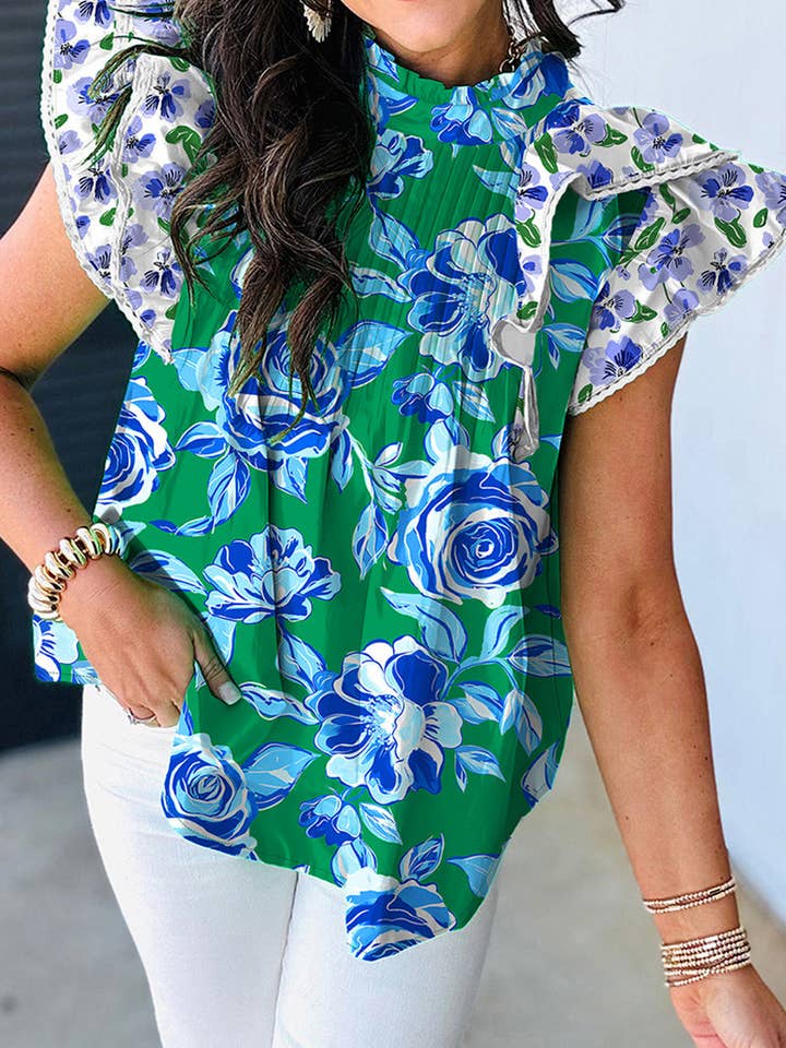 Blusa floreale con maniche arruffate per la vendita all'ingrosso da parte di Mccolin