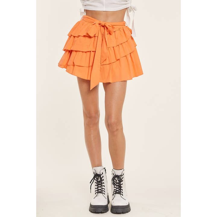 MINI-JUPE À VOLANTS SUPERPOSÉS ET CEINTURE pour la vente par idem ditto