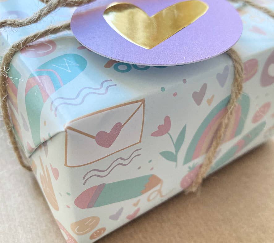 NynkeOntwerpt – Engroshandel Gavepapir – Indpakningspapir med solnedgangs-doodles | Egen illustration2