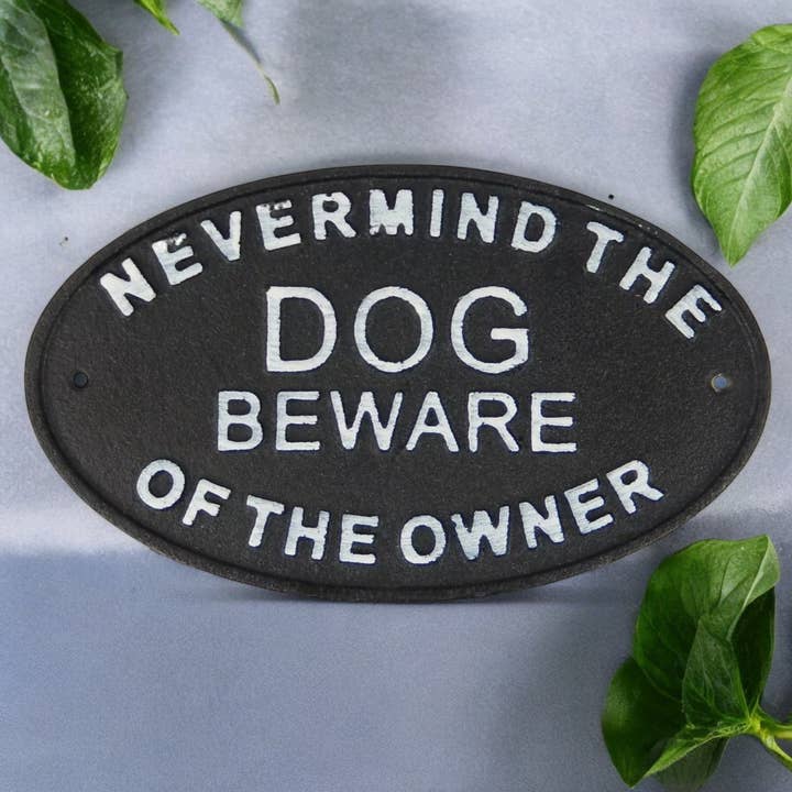 Tongue-in-Cheek Cast Iron Plaque: Nevermind Dog, Beware Of The Owner for wholesale by Iron & Blossom