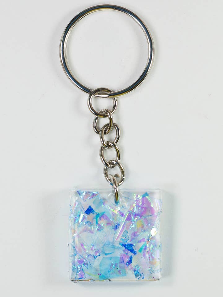 Portachiavi Olografico Dicroico Quadrato Blu per la vendita all'ingrosso da parte di Finessed Media LLC
