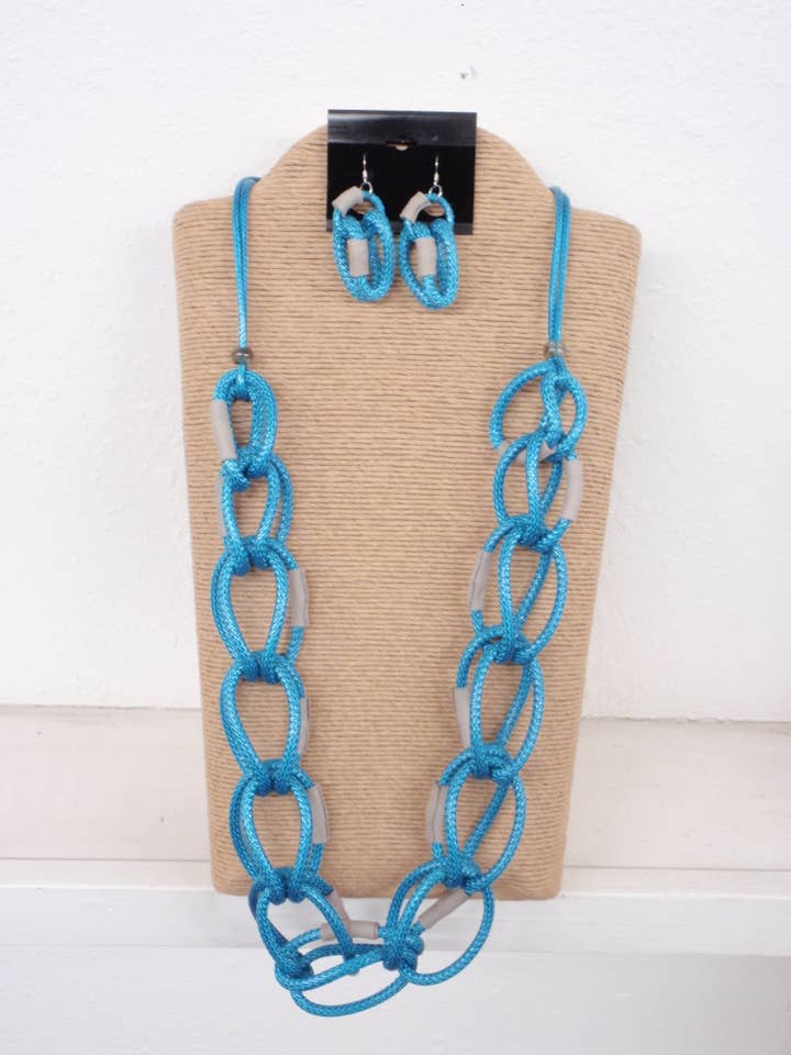 CORDON CIRÉ TURQUOISE AVEC ANNEAUX RONDS EN FIL CIRÉ AVEC FILET EN CUIR pour la vente par International Duru's