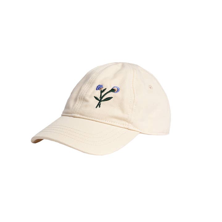 Beige babypet met geborduurde bloemen voor wholesale door Miles the Label