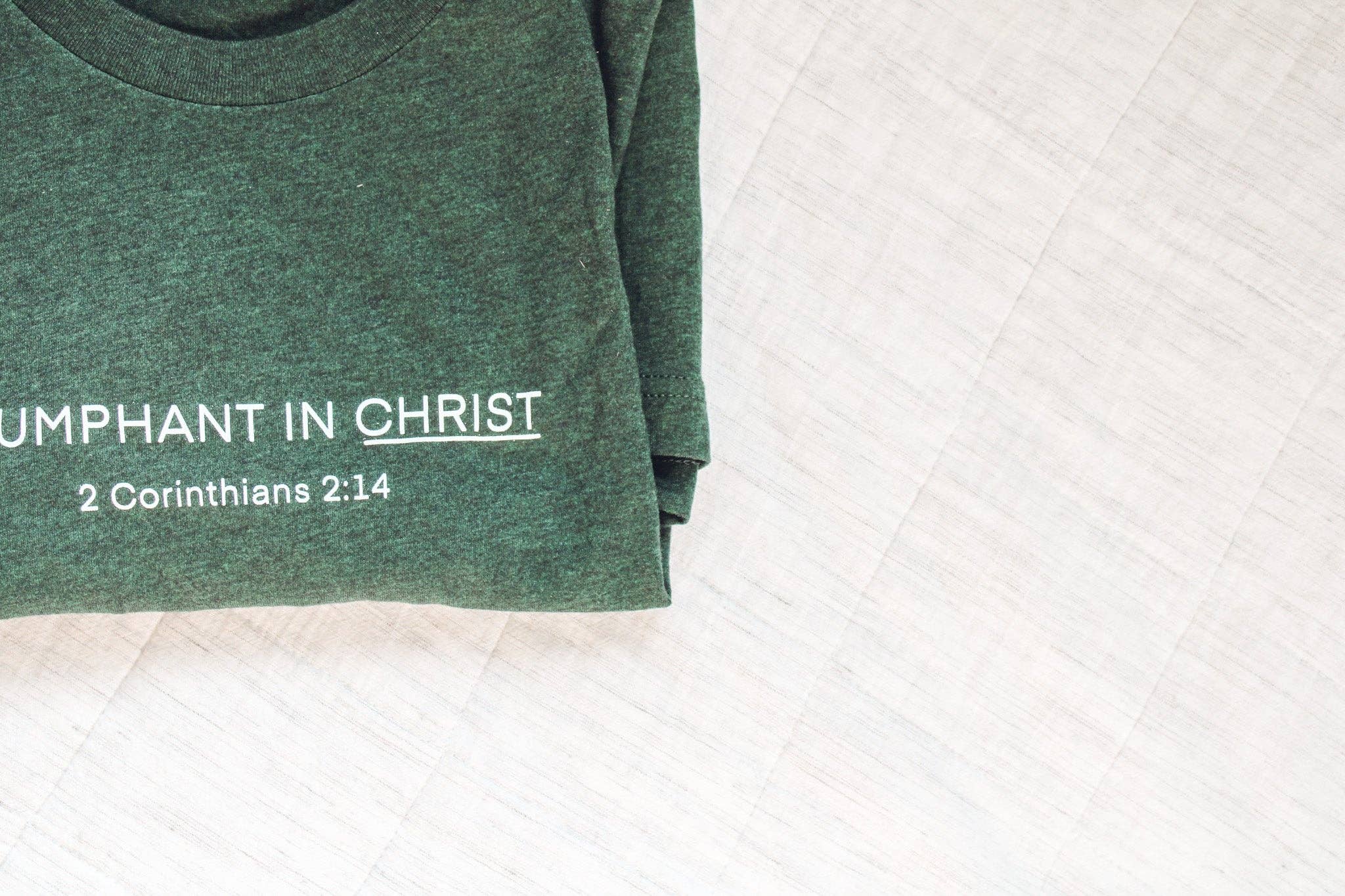 Common Grace Print Shop - Wholesale Screen Printed T-Shirt - Women's - Triumphant in Christ UNISEX Short-Sleeve T-Shirt (Color: Heathered Emerald)3