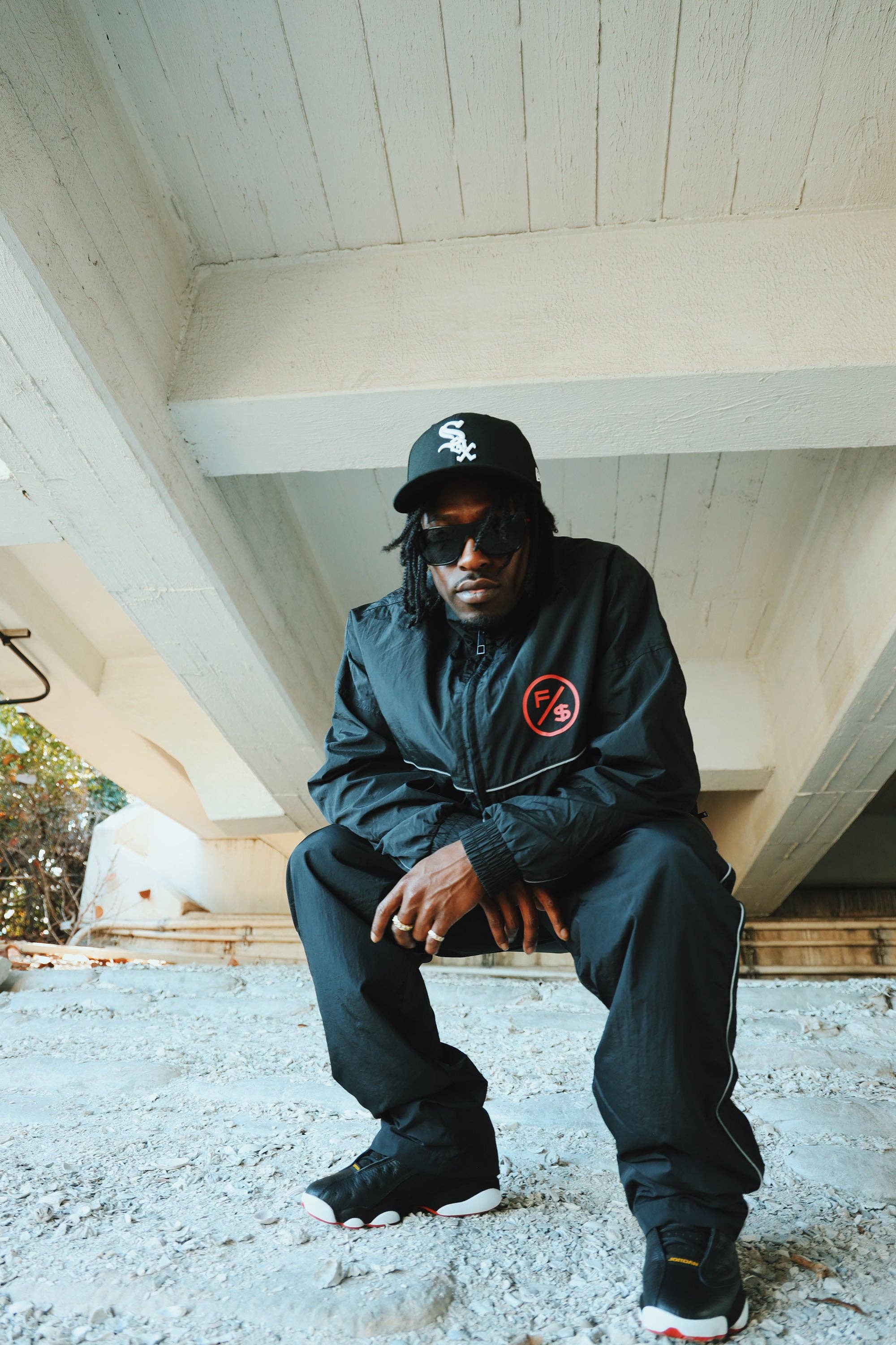 Black Red MOTION Nylon Pants (BRED) for wholesale on Faire4