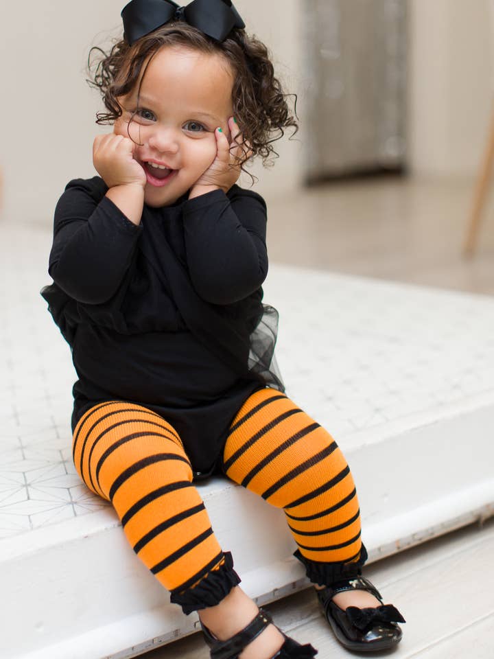 Multicolore Collant senza piede a righe arancioni e nere con volant per ragazze in vendita all'ingrosso su Faire2