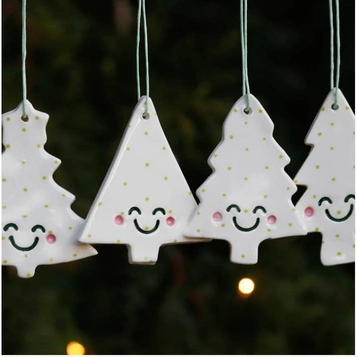 Set of 4 Christmas Tree Ornaments With Smiley Faces for wholesale by White Rain Ceramics