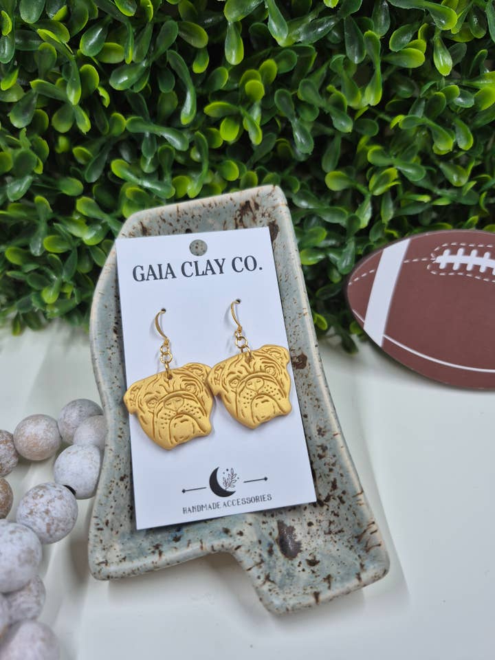 Game day gold dog dangles for wholesale by Gaiaclayco