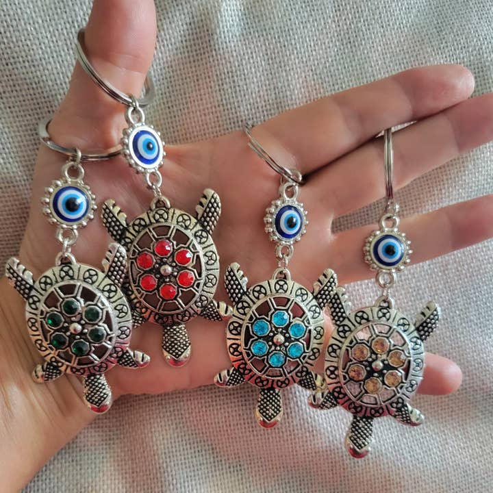 Handmade Turtle Keychains with Evil Eye Charm and other Purchase Wholesale turtle keychain. Free Returns & Net 60 Terms on Faire trending on Faire.