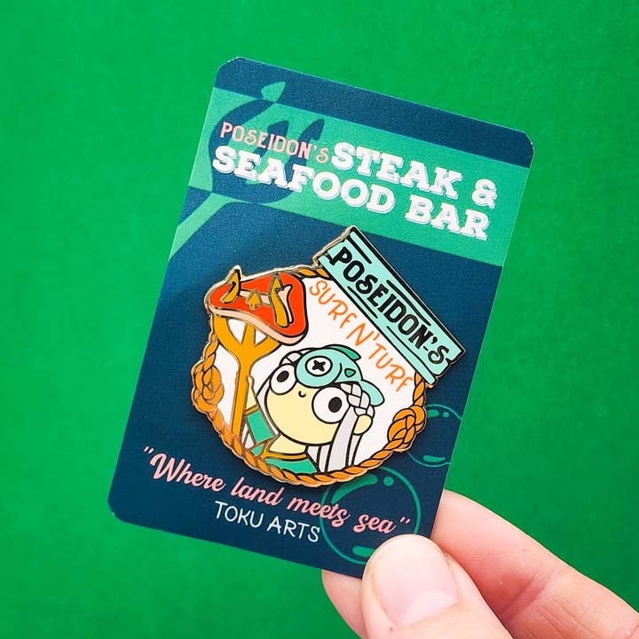 Poseidon's Surf n' Turf Enamel Pin for wholesale by Toku Arts