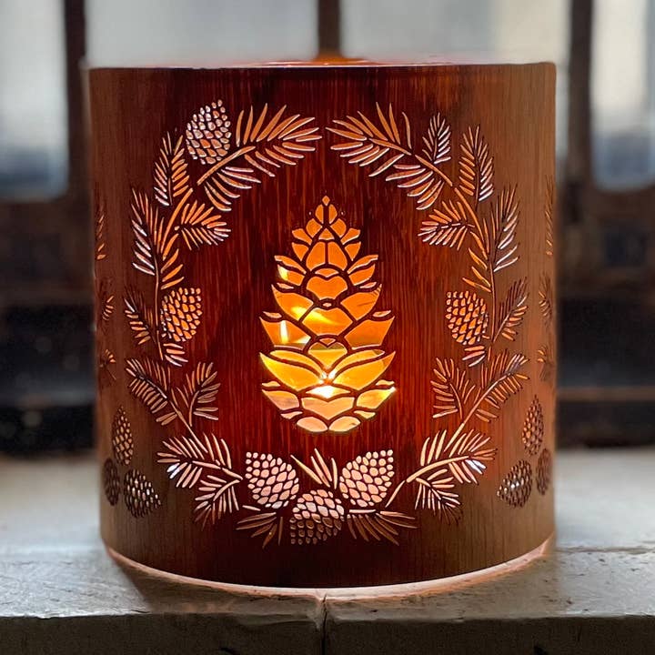 A Christmas pinecone candle holder. Artistic Candle Holder for wholesale by LanternCozies