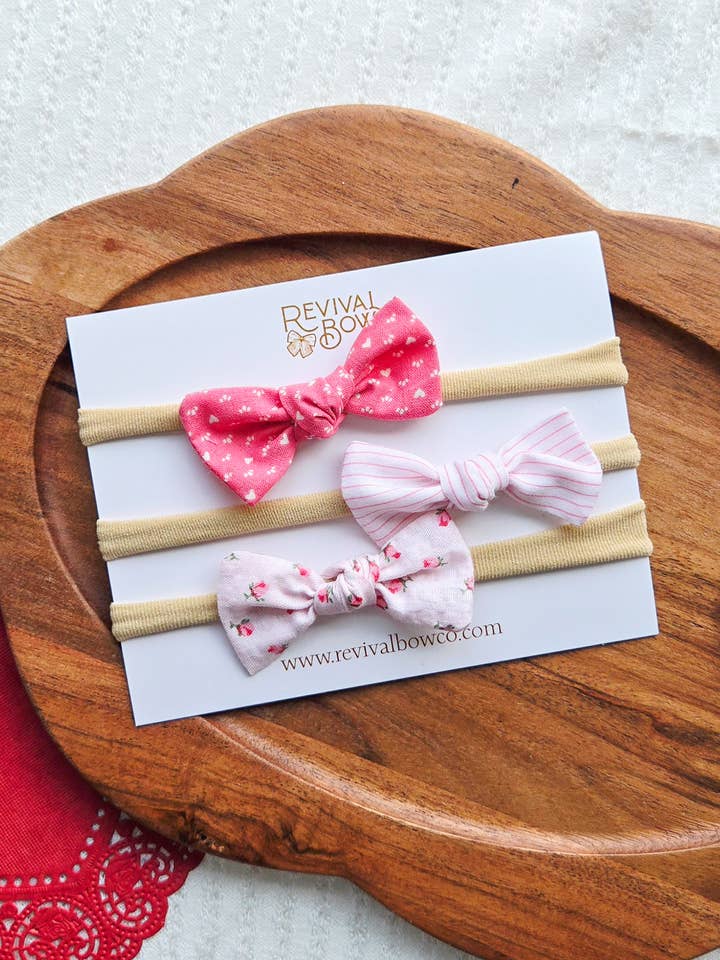 Vintage Pink Knot Bow Set on Headband for wholesale by Revival Bow Co.