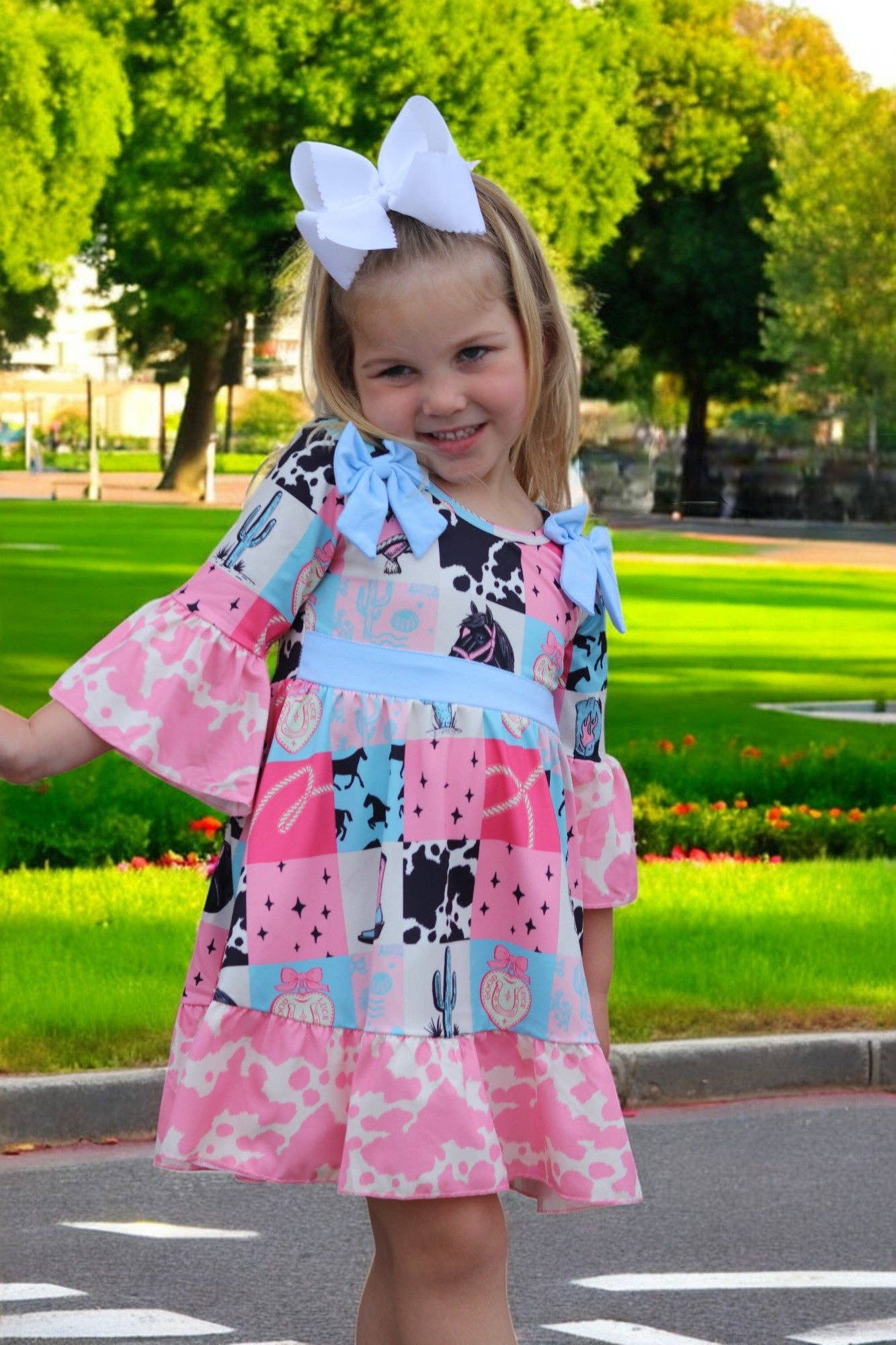 Kids Charm Online - Wholesale Dress - Kids - Beautiful wester patch printed girls dress with bows and cow printed hem.9