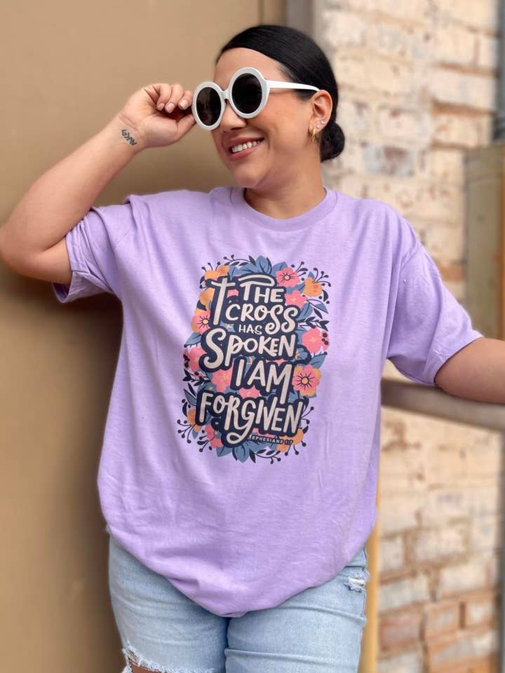 Gildan Lilac The cross has spoken I am forgiven (T-Shirt) for wholesale on Faire