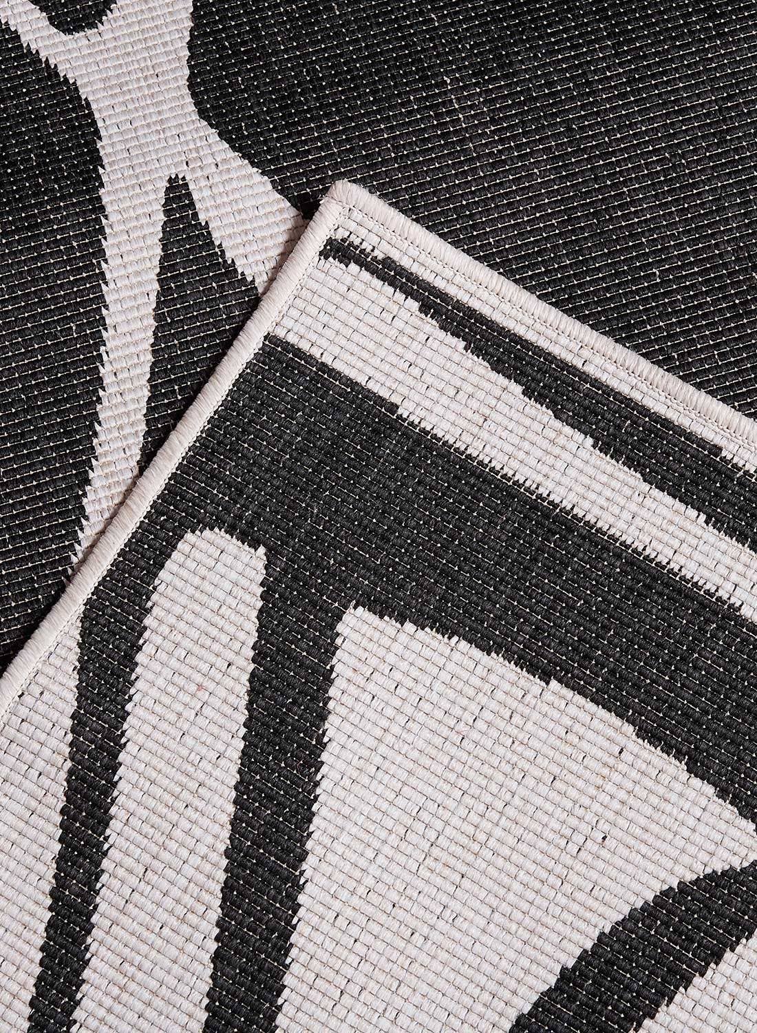 Black AF ARIBIA REVERSIBLE Polypropylene Outdoor Rug for wholesale on Faire1