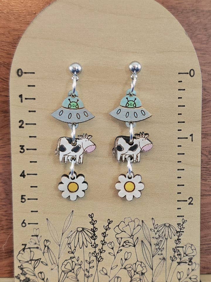 Cow & Alien Dangle Earrings for wholesale by Silver Birch Designs Jewelry