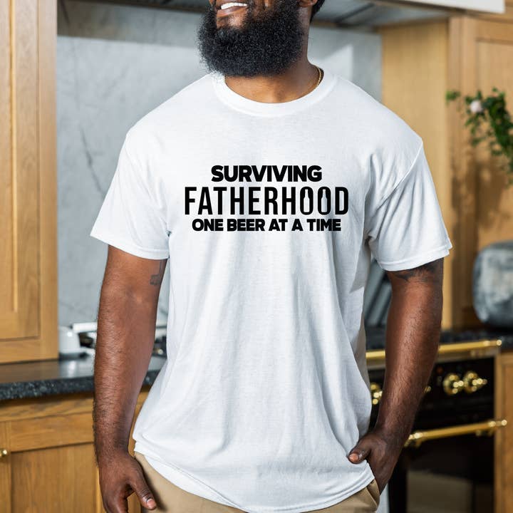Surviving Fatherhood one beer at a time shirt for wholesale by Kayla Lynn Creates, LLC