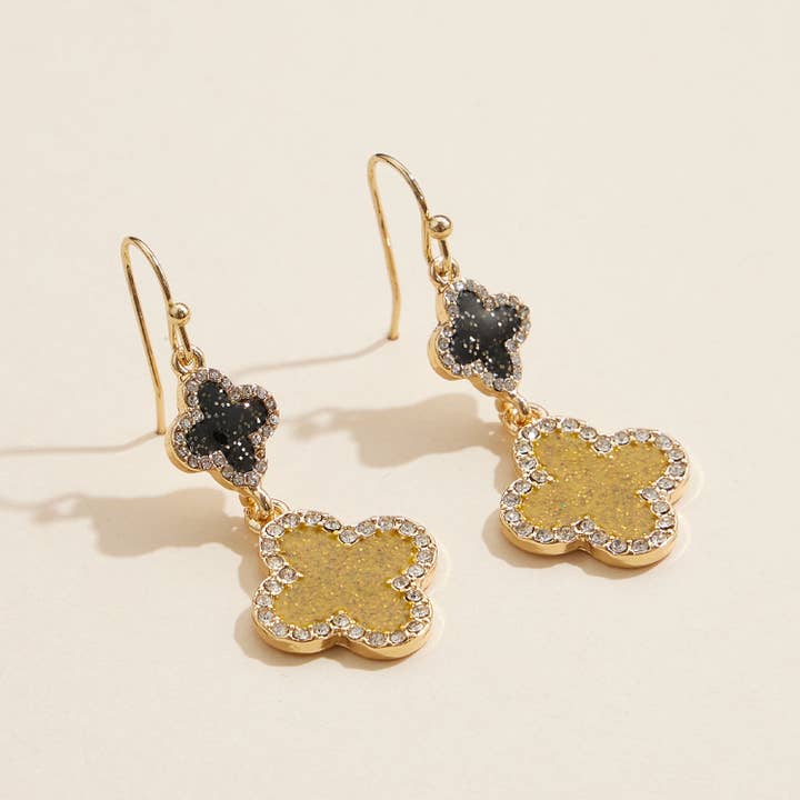 Boucles d'oreilles pendantes double trèfle or et noir Mardi Gras avec accents en strass pour la vente par Frem