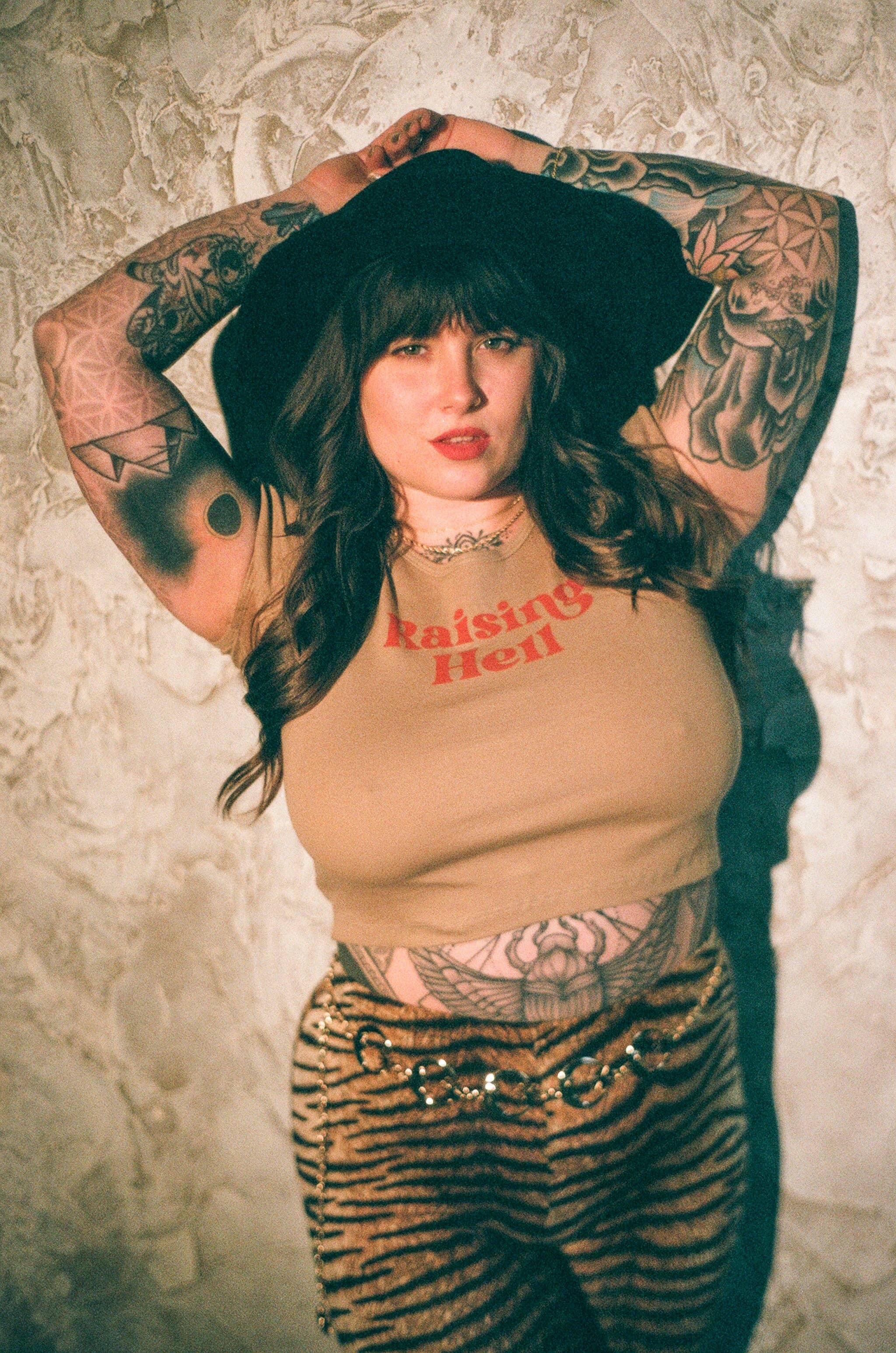 Tan Raising Hell 90's Baby Crop Tee for wholesale on Faire5